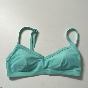 Xhilaration swim top. Size Medium. Aqua color. Lined, adjustable back & straps.